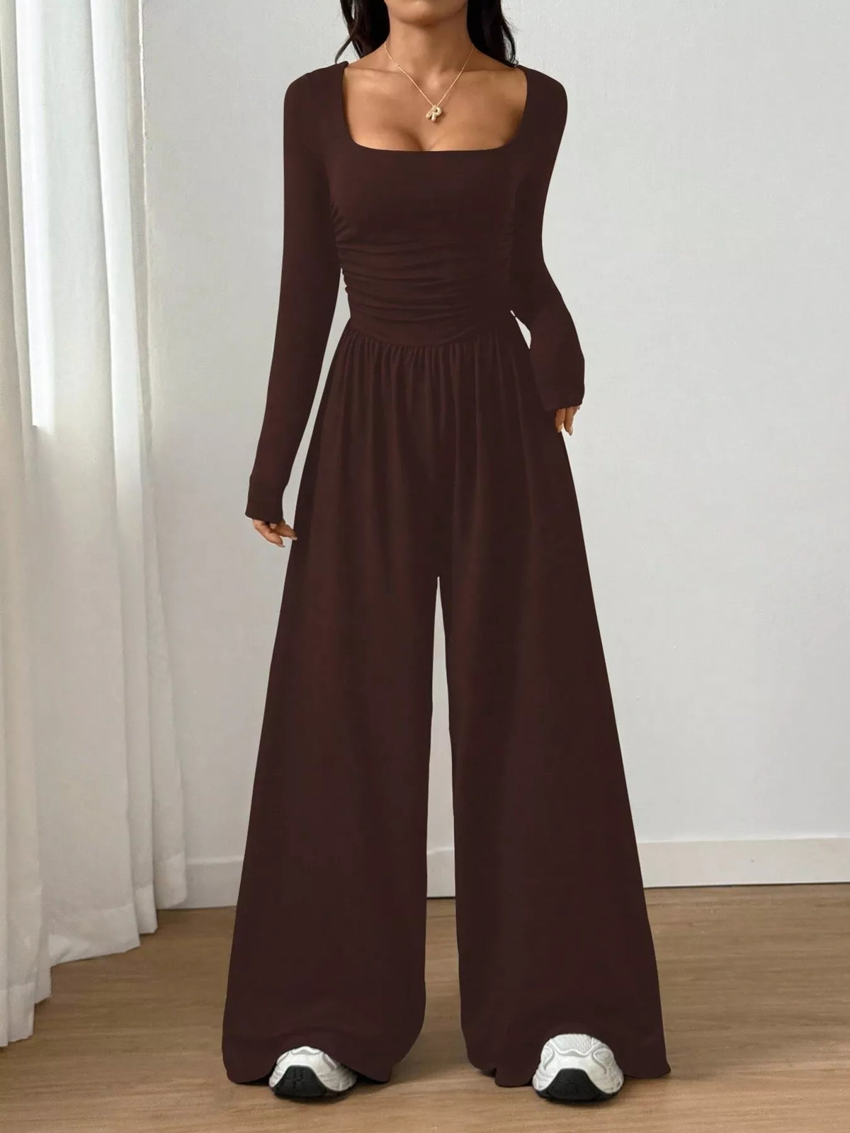 Ruched square neck wide-leg jumpsuit from Trendsi featuring a stylish silhouette and comfortable fit, shown on a model.
