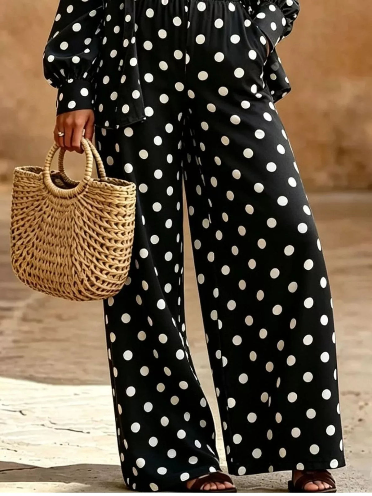 Plus size polka dot shirt and wide-leg pants set by Trendsi, featuring a stylish polka dot top with flowy wide-leg trousers.