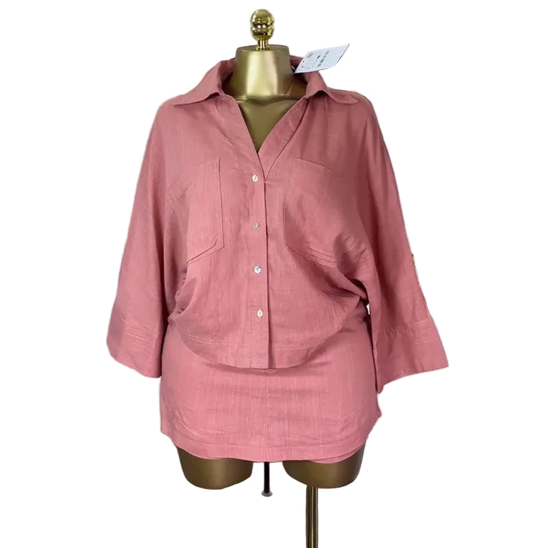 Plush Fashion Hub modern two-piece batwing shirt and high-waisted skirt set, stylish tops with relaxed fit and trendy design.