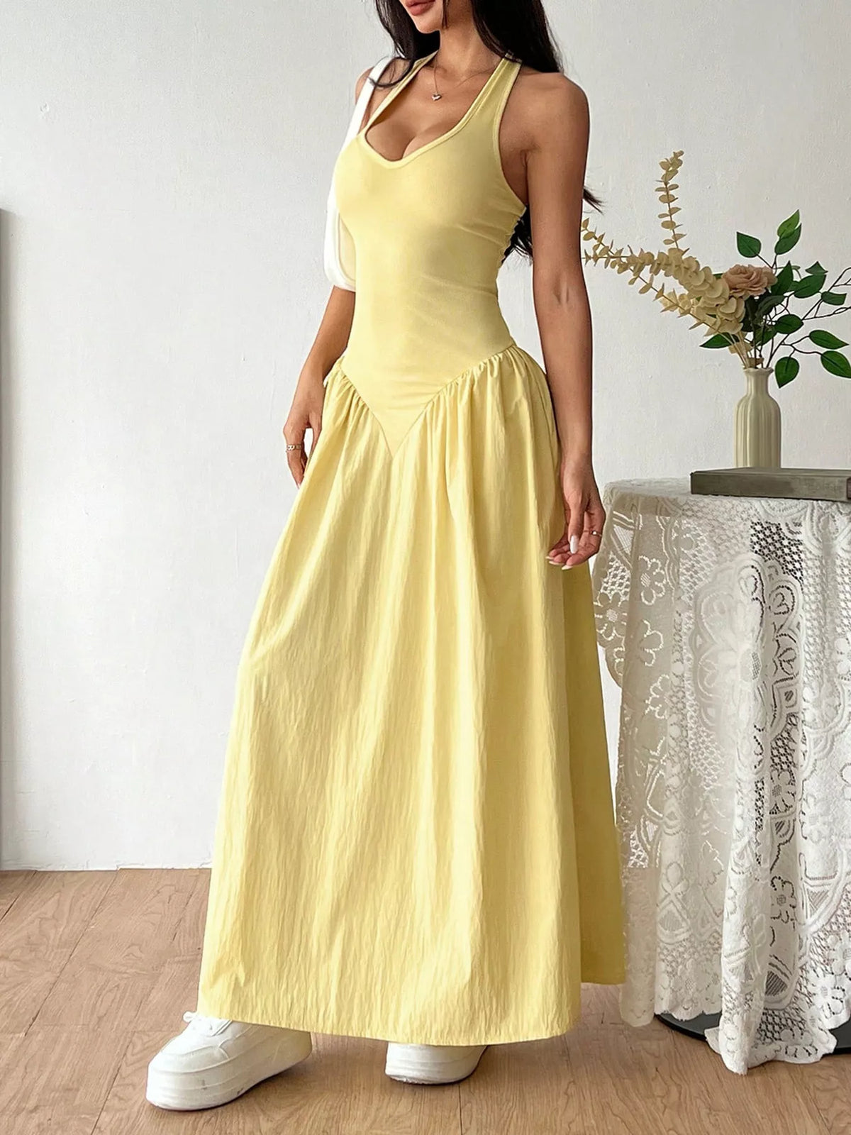Plush Fashion Hub halter neck ruched maxi dress in flowing fabric, featuring a fitted bodice and elegant length, perfect for formal occasions.