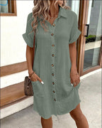 Women's casual loose short-sleeve midi shirt dress with button-down front by FitiqueFit, shown hanging on a wooden hanger.