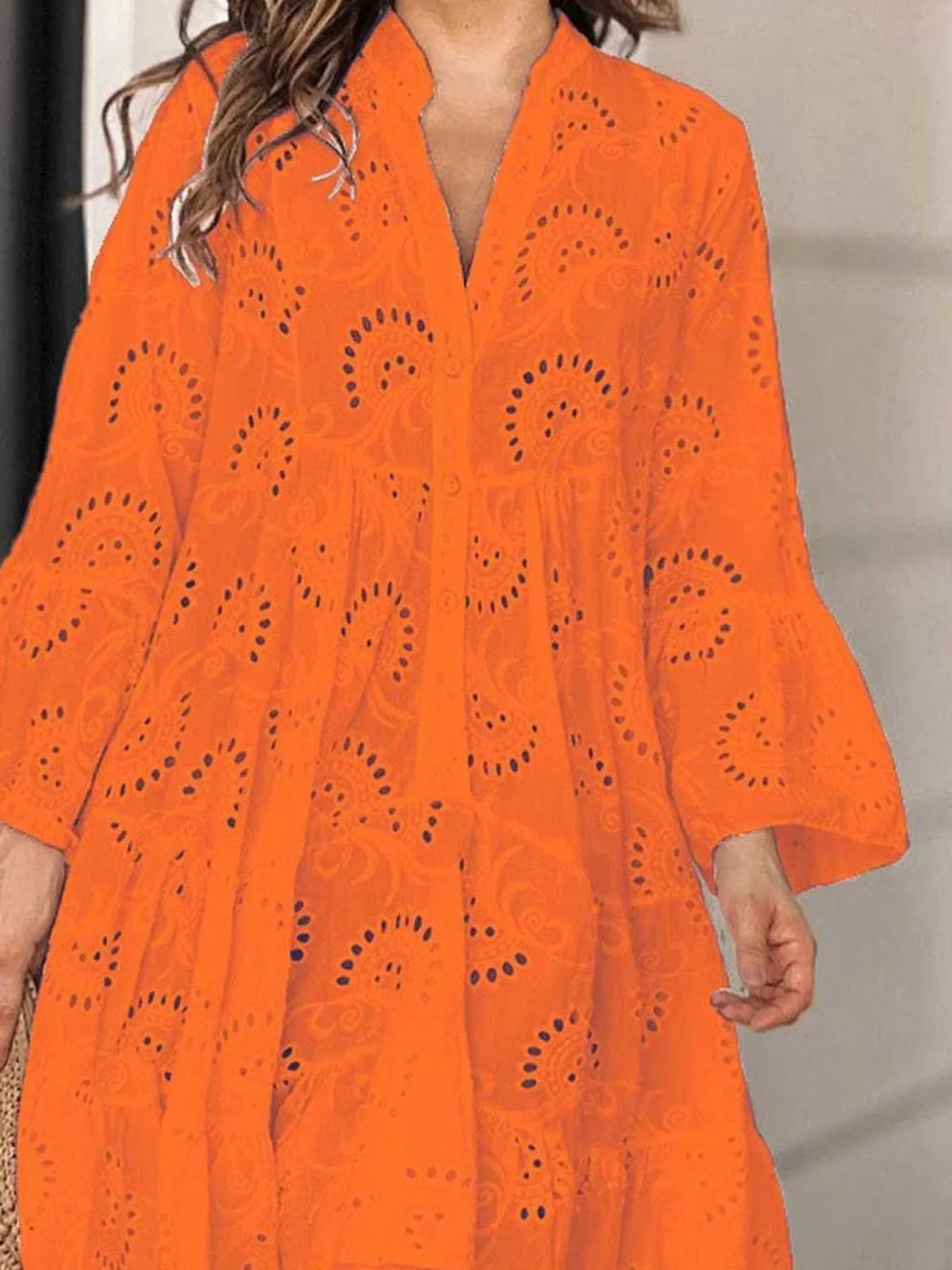 Full size eyelet ruffled hem tiered dress by Trendsi featuring a flowy, layered design with eyelet details and a ruffled hem.