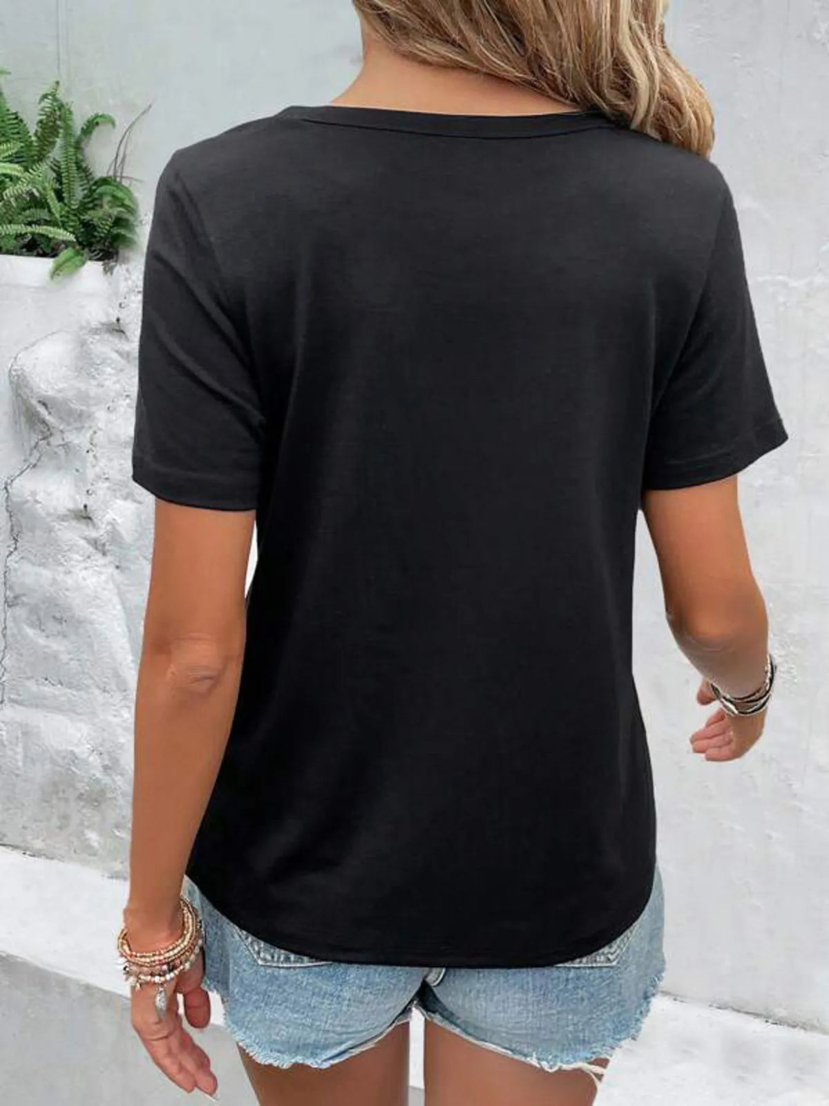 Plush Fashion Hub short sleeve T-shirt with hollow out neckline, casual tops in black, featuring a stylish cutout design.