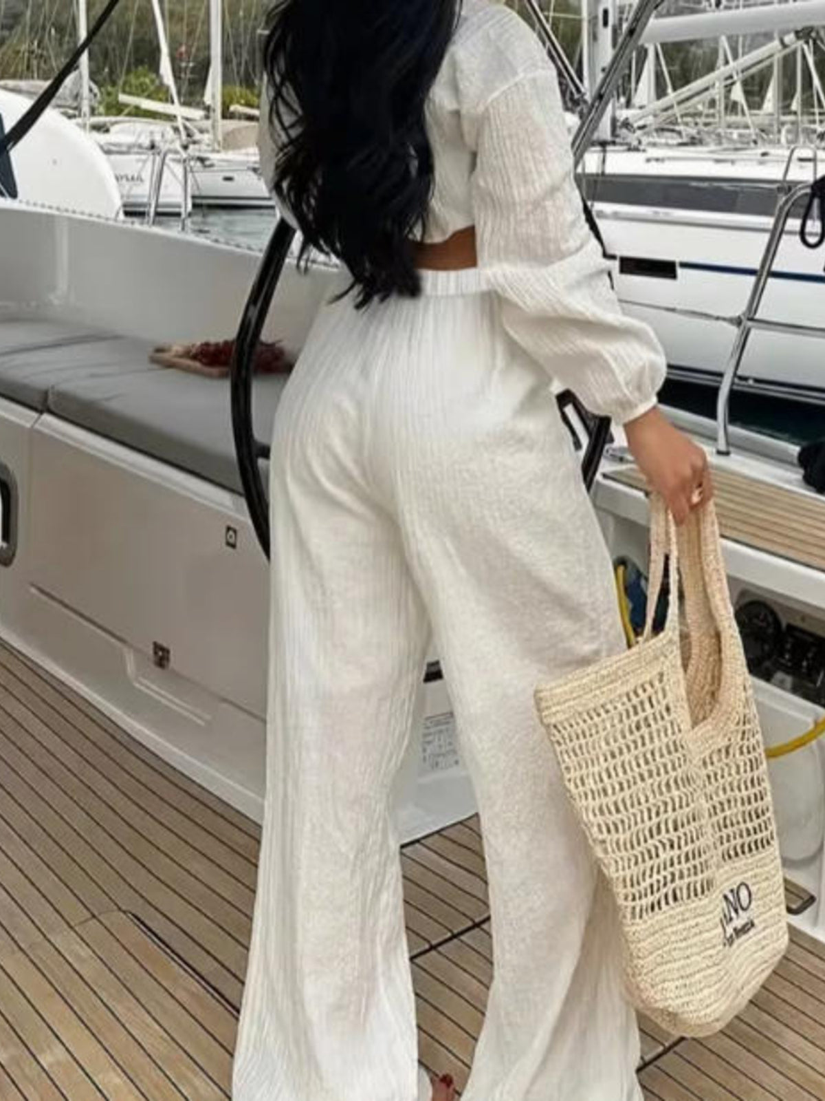 Textured tie-front crop top and wide-leg pants two-piece set by Plush Fashion Hub, featuring a stylish matching outfit.