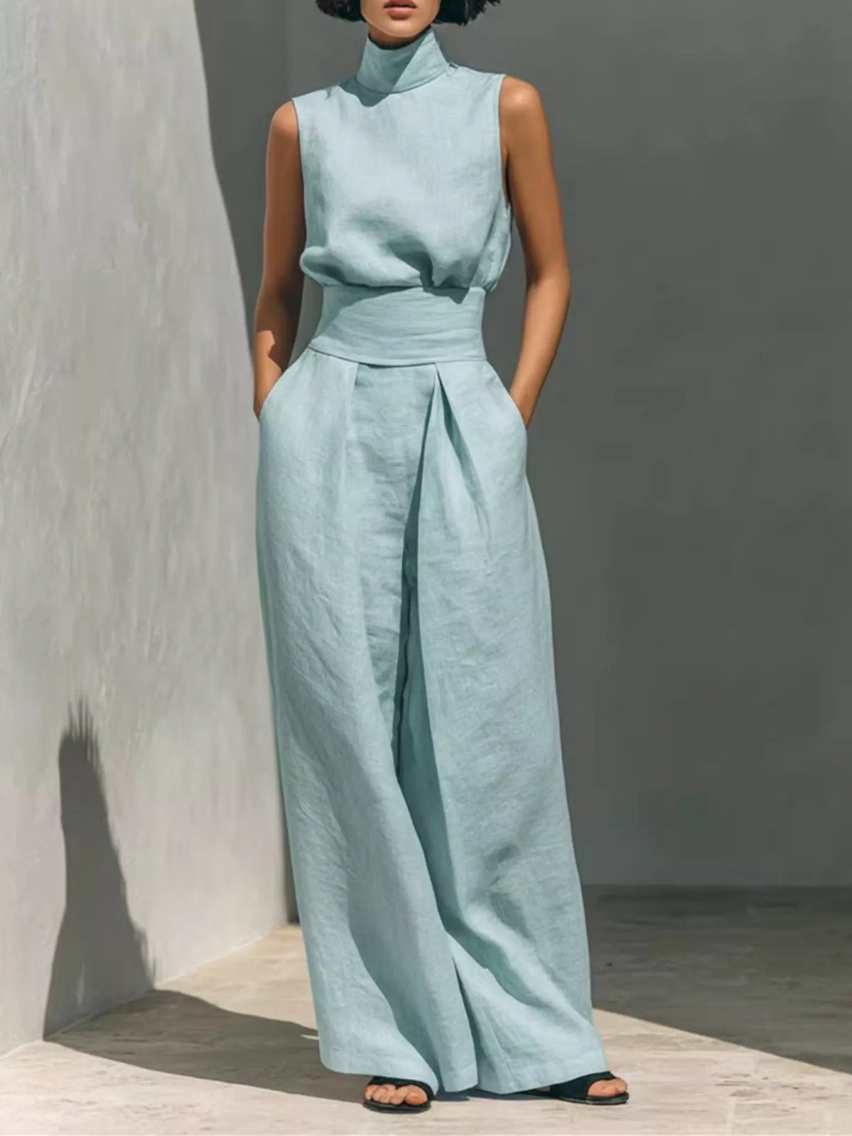 Plush Fashion Hub turtleneck sleeveless top and wide-leg pants set in soft fabric, displayed on a hanger against a neutral background.