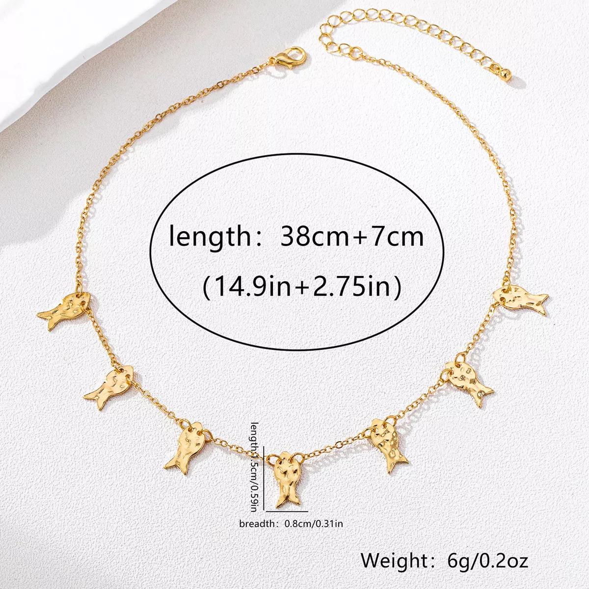 18K gold-plated fish charm necklace with delicate chain, featuring a detailed fish pendant, crafted by Plush Fashion Hub.