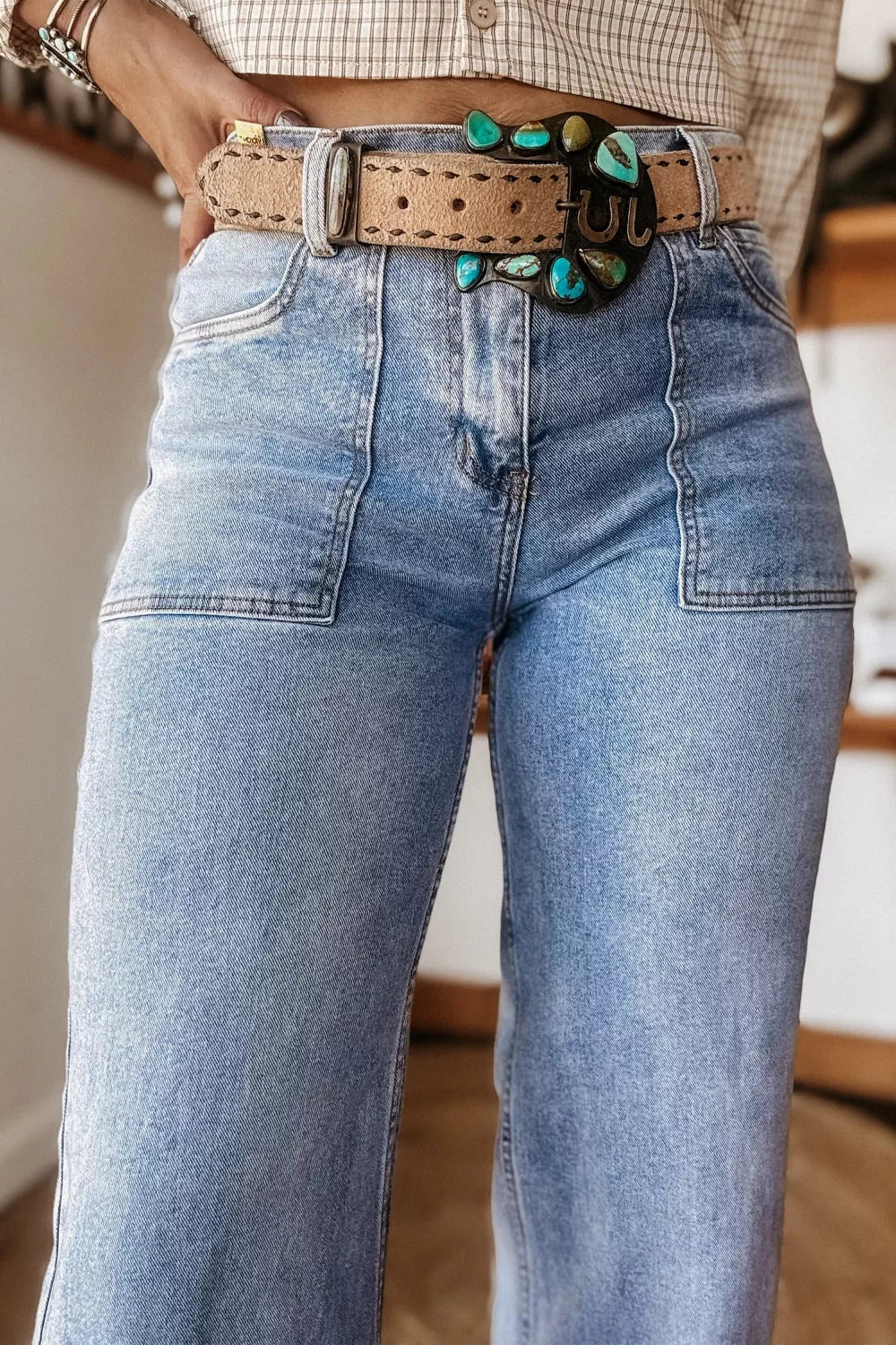 Pair of loose-fit jeans with turn-up cuffs from Plush Fashion Hub, showing dark denim fabric and casual relaxed style.
