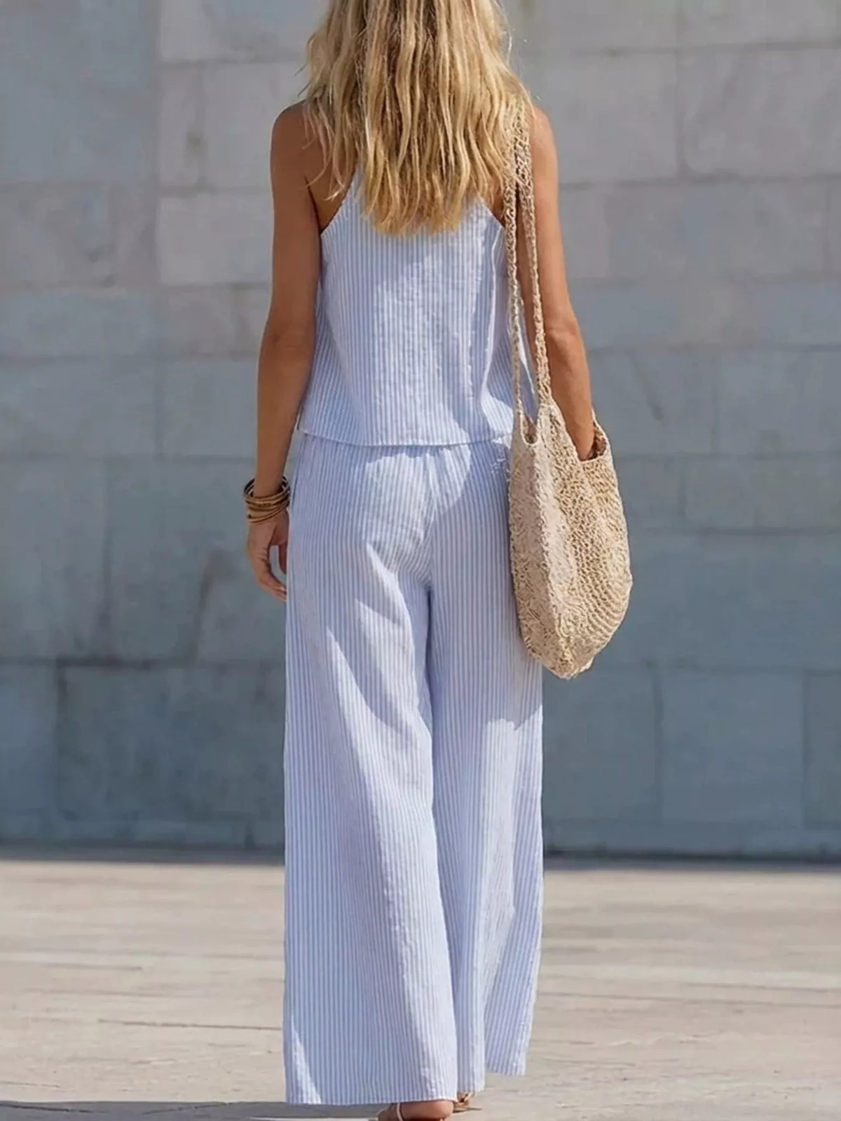 Striped V-neck tank top and wide-leg pants set by Plush Fashion Hub, featuring a stylish matching outfit with a relaxed fit.