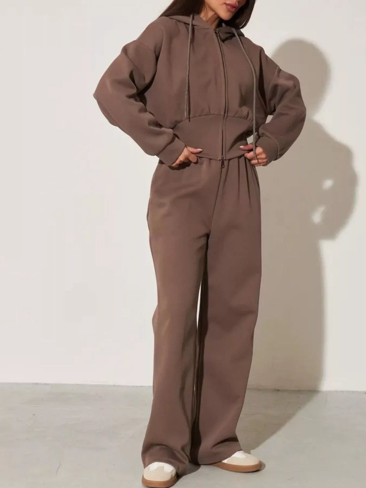 Plush Fashion Hub zip-up hoodie and wide-leg pants loungewear set worn by a model, in soft fabric, casual and comfortable style.
