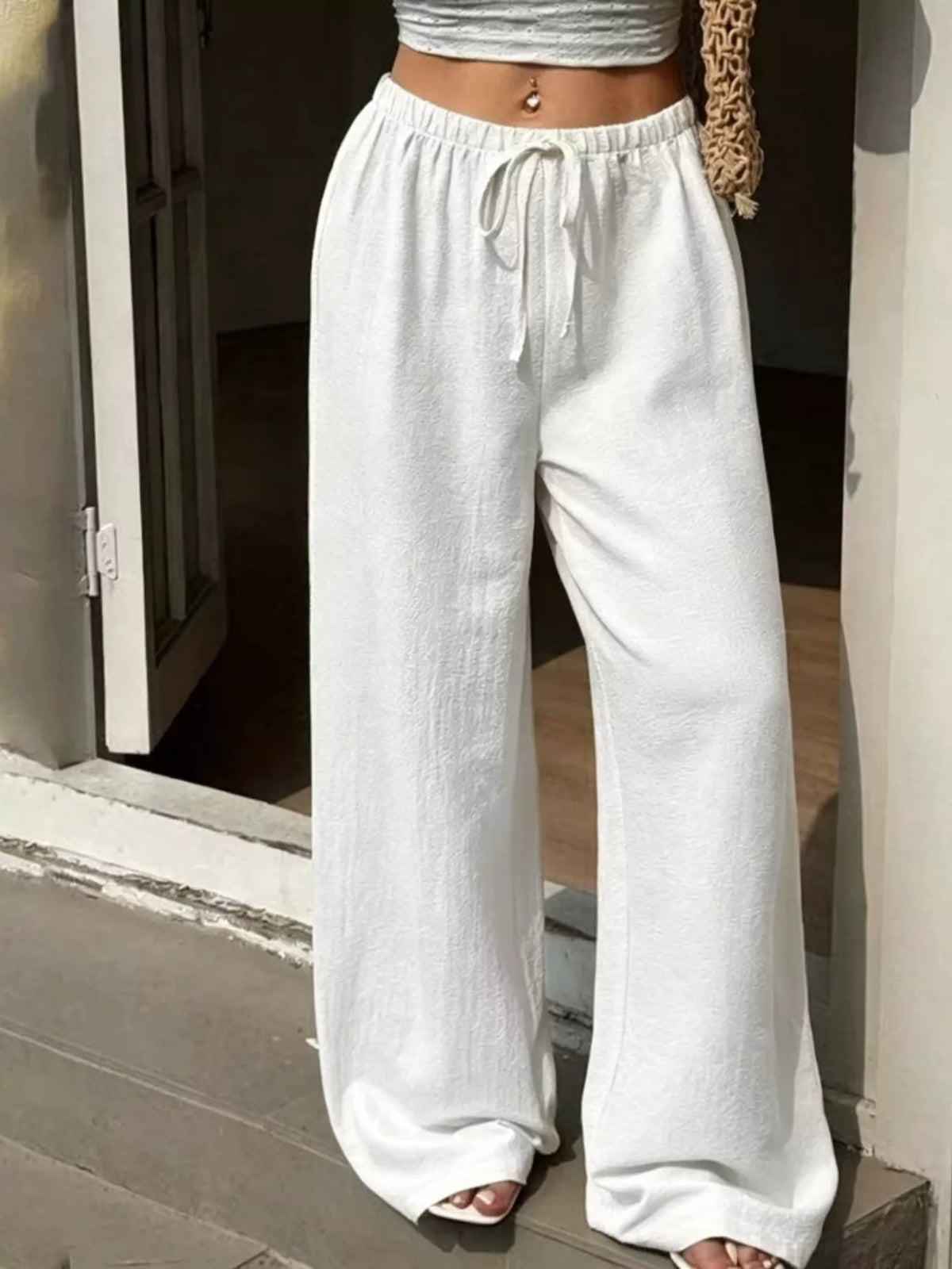 Plus size high-waisted wide-leg pants from Plush Fashion Hub, featuring a relaxed fit and flowing silhouette.