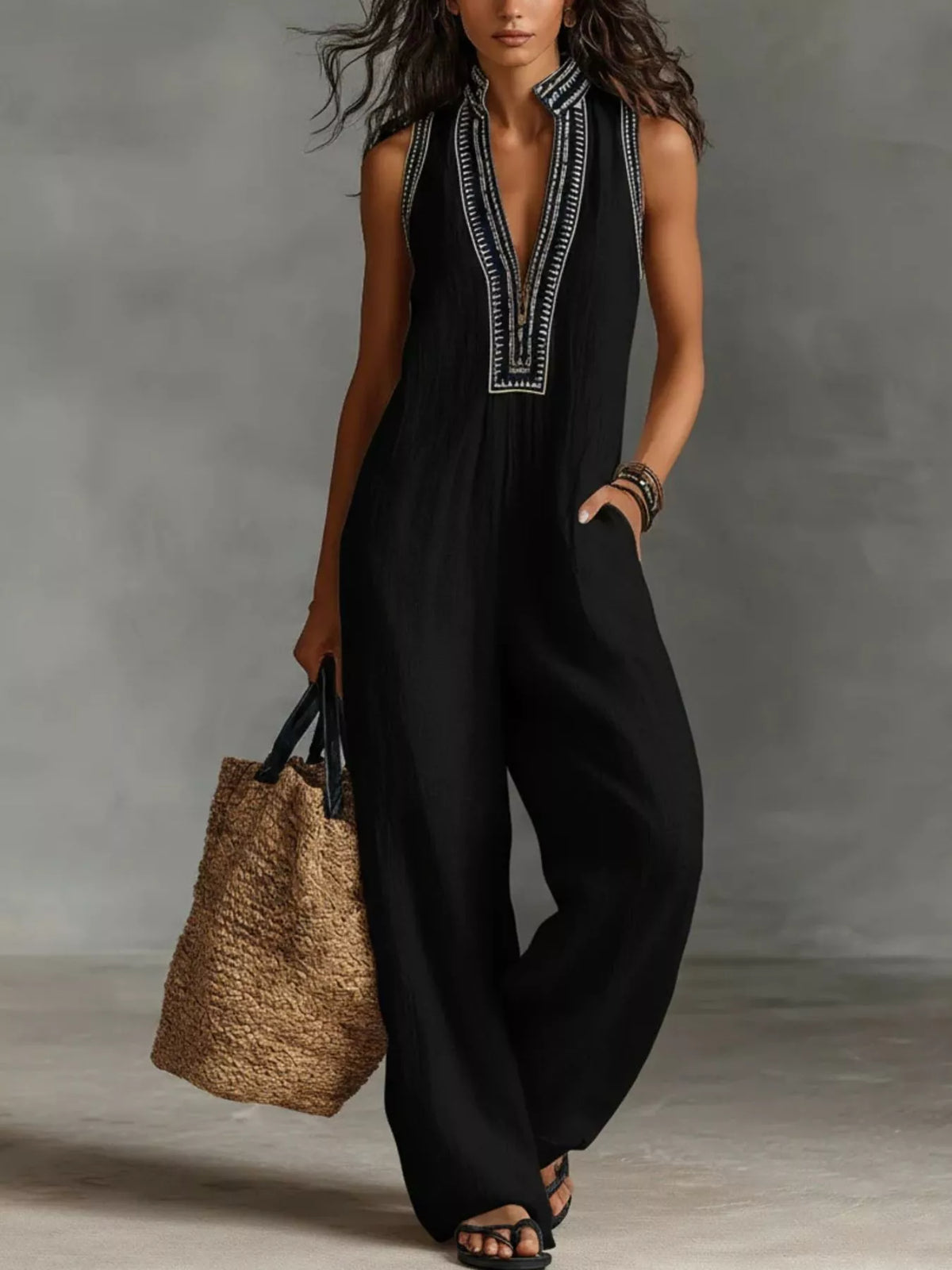 Plus size full length sleeveless wide leg jumpsuit from Trendsi, featuring a flattering fit and flowing fabric.