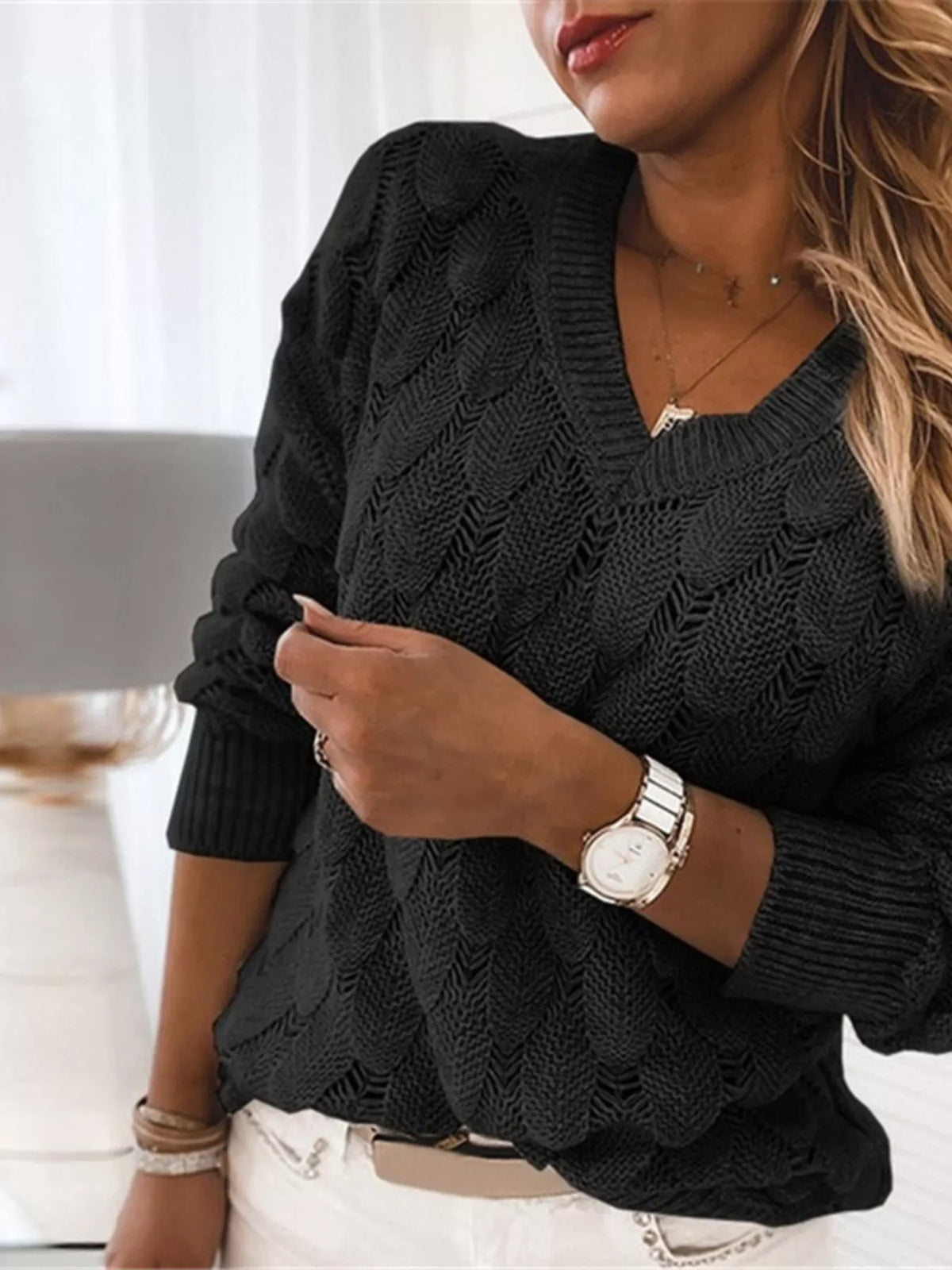 V-neck knitted sweater from Trendsi, featuring a cozy, soft fabric in a versatile style perfect for casual wear.