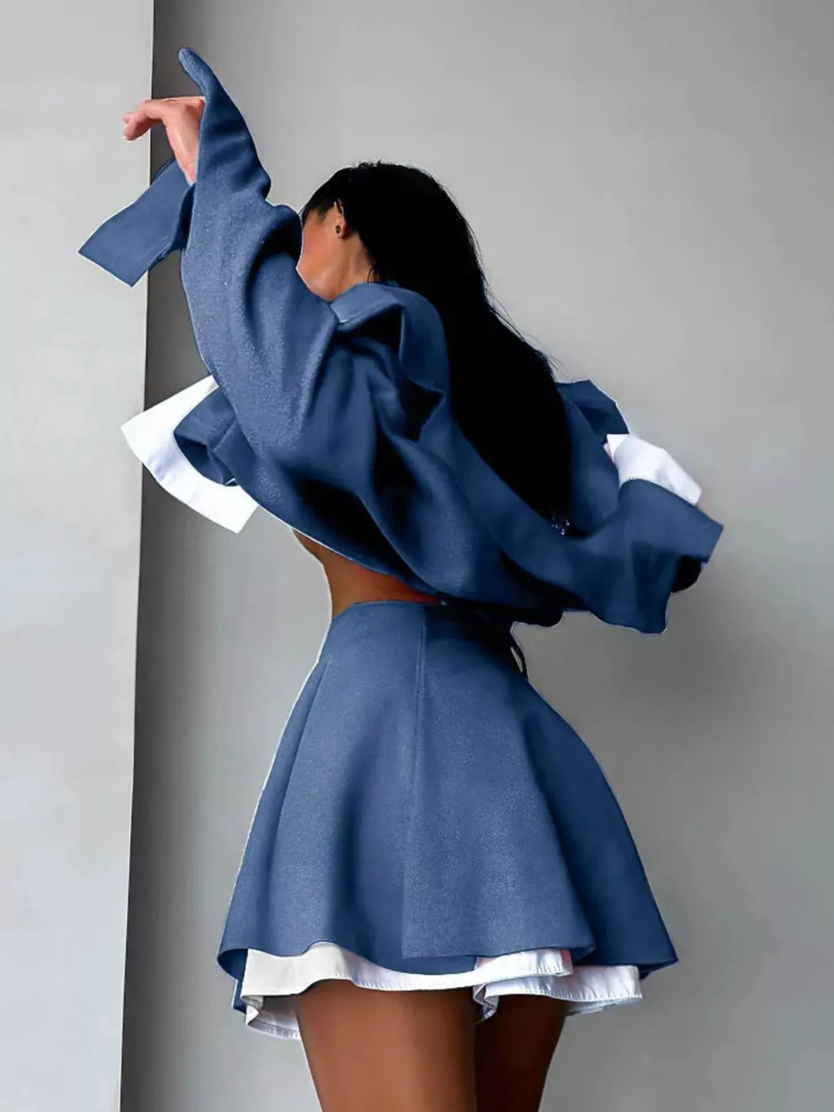 Trendsi cropped jacket and mini skirt set featuring a stylish button-up design, perfect for trendy, casual looks.