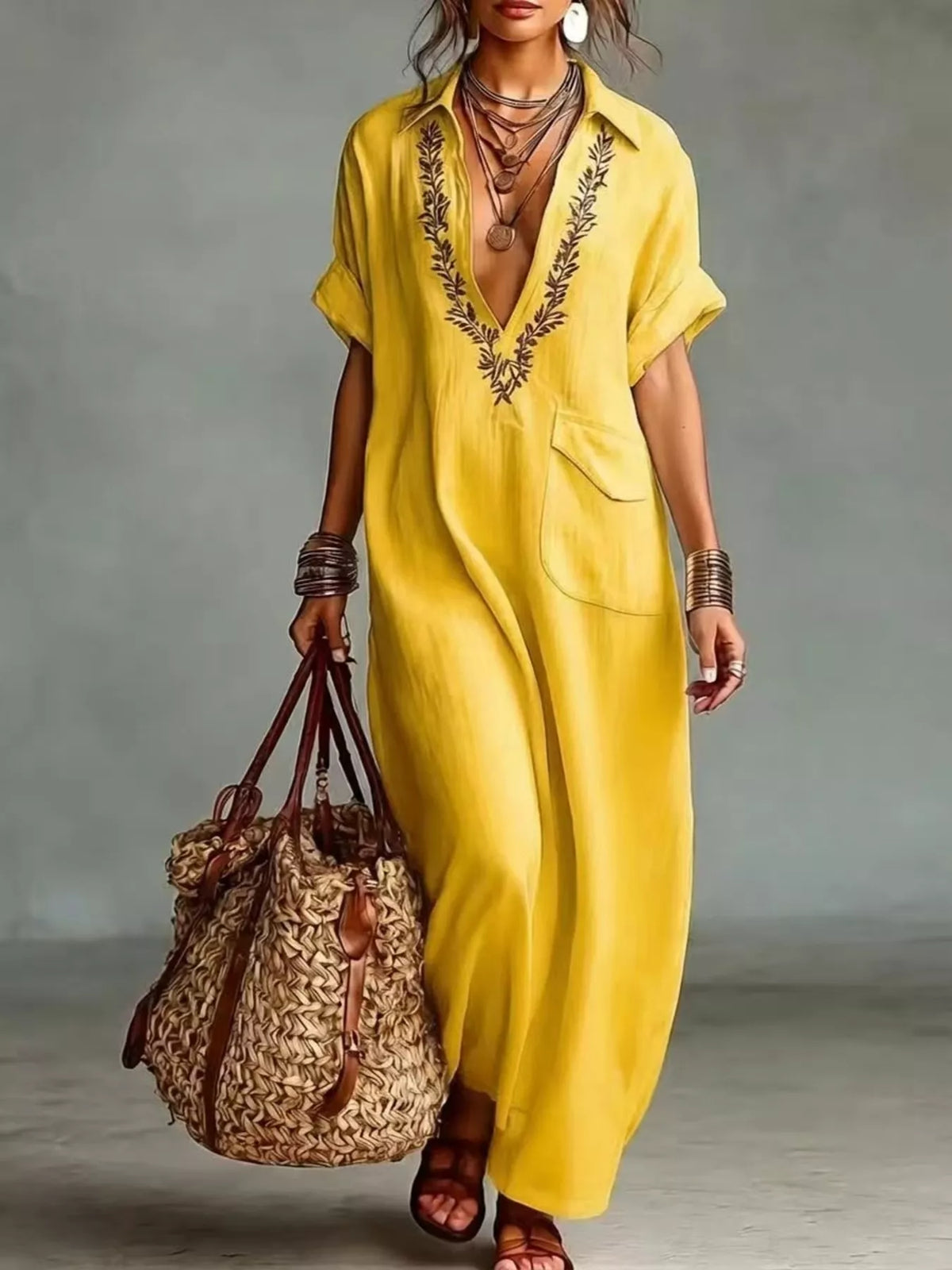 Plus size bohemian embroidered maxi dress with colorful patterns and flowing fabric, perfect for casual or beach wear.