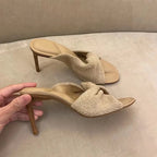 Elegant black stiletto heels with bow accents from eprolo, featuring slim heels and open toes for stylish wear.