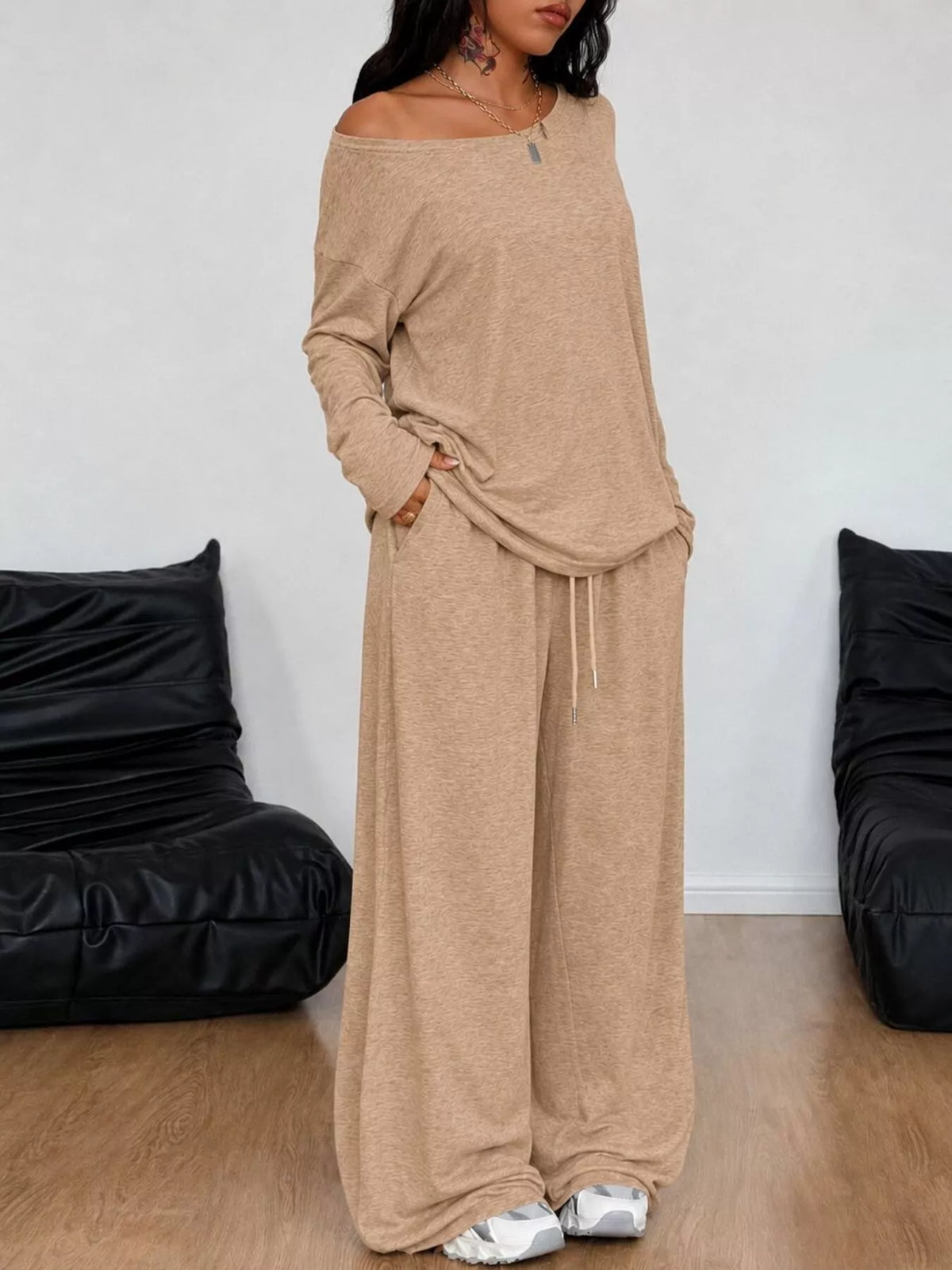 Plus size loose fit one-shoulder t-shirt and pants set by Trendsi, casual matching outfit for comfortable style.