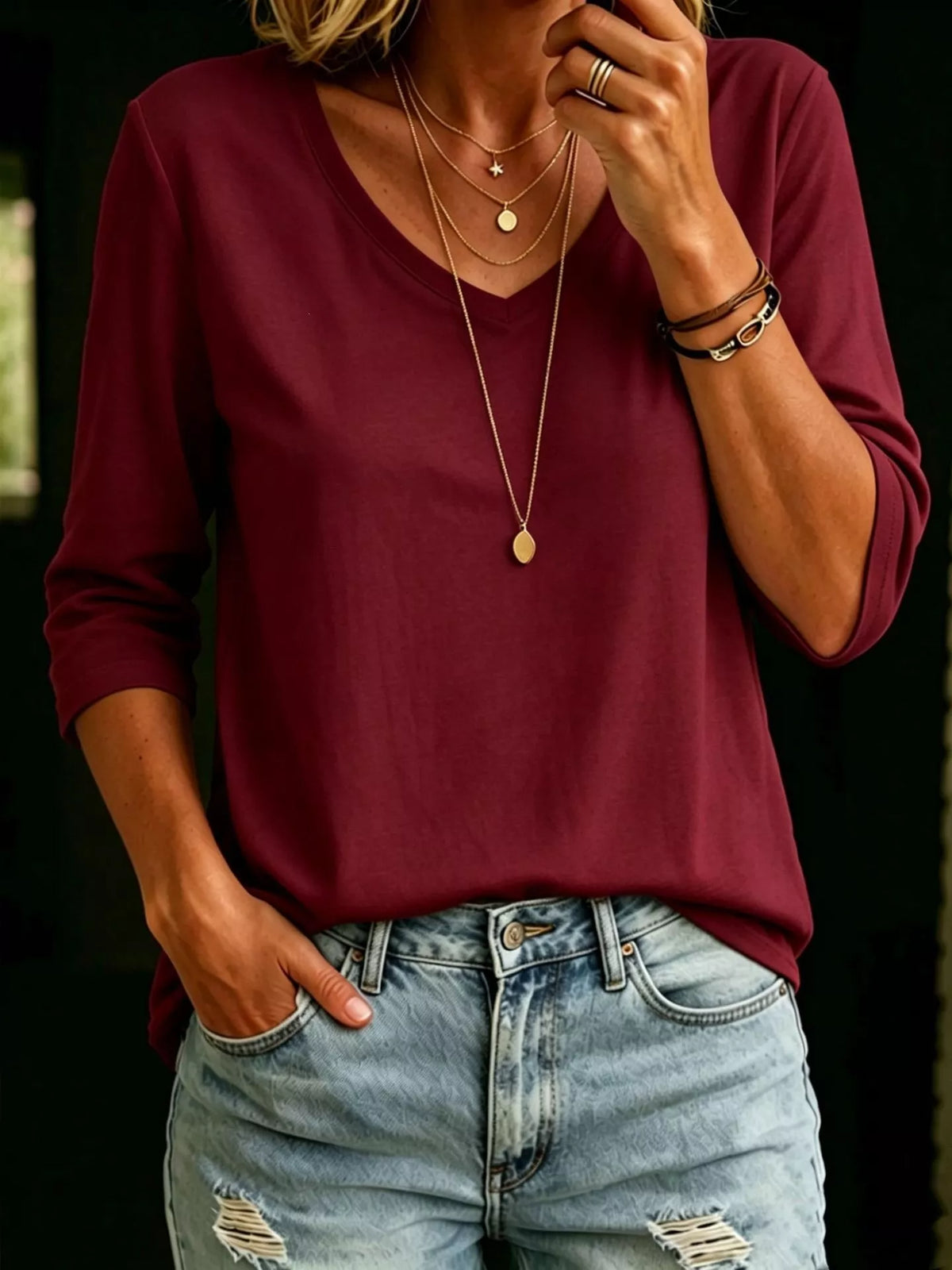 Plus size V-neck T-shirt with 3/4 sleeves from Trendsi, casual full-size top in soft fabric, displayed on a neutral background.
