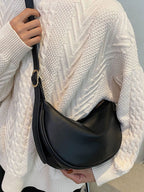 Minimalist crescent crossbody bag in smooth PU leather, trendy shoulder purse for everyday wear, stylish and compact.