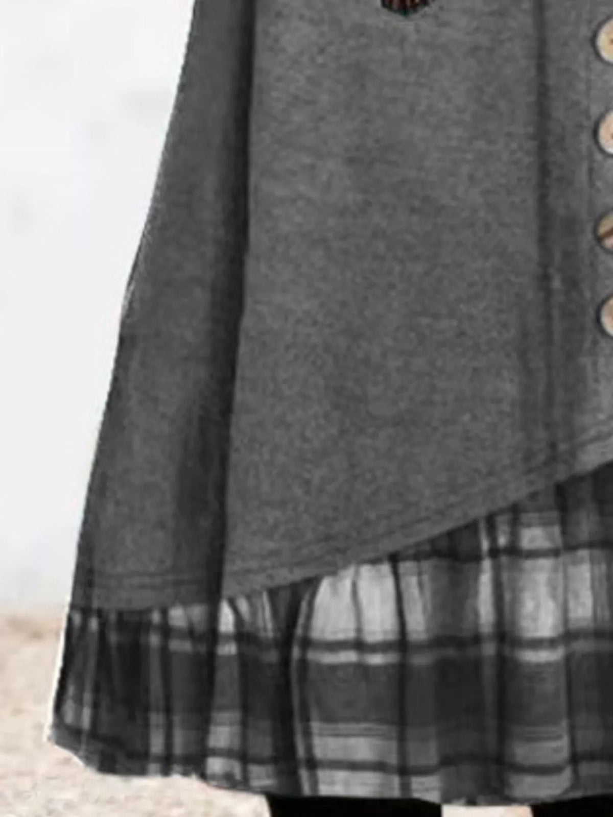 Plus size asymmetrical plaid patchwork long sleeve dress by Trendsi, featuring a stylish design and full coverage for curvy figures.