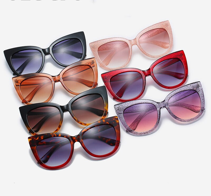 Women's oversized cat eye sunglasses by Plush Fashion Hub with UV400 protection, featuring bold black frames and stylish design.