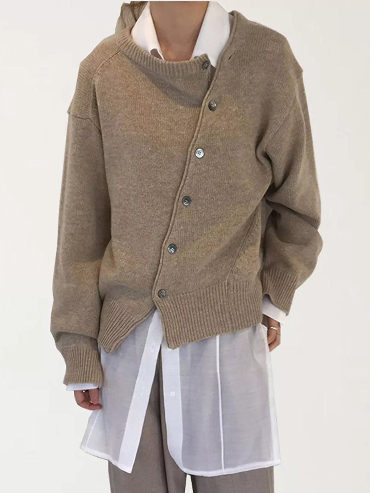 Asymmetric button-down sweater by Trendsi featuring a stylish design with unique button placement and cozy knit fabric.