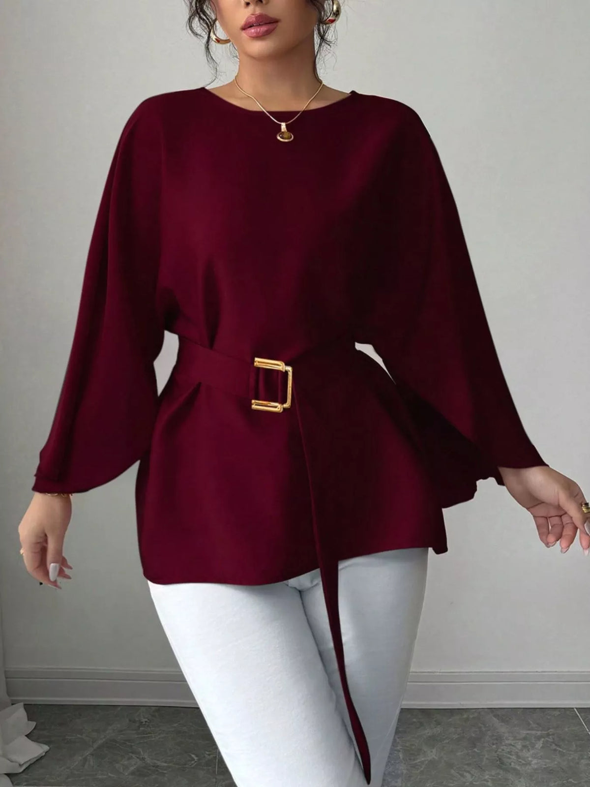 Plush Fashion Hub batwing sleeve belted blouse with a relaxed fit, featuring flowy sleeves and a waist belt for stylish comfort.