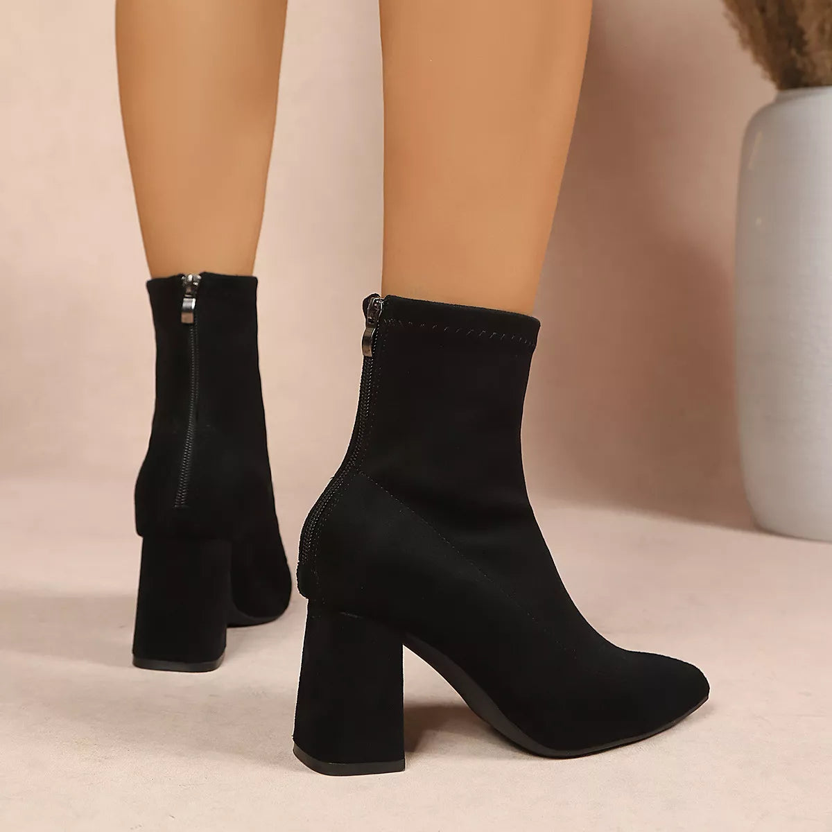 Women’s point toe block heel ankle boots by Trendsi, featuring a stylish design with a sleek silhouette and comfortable ankle fit.