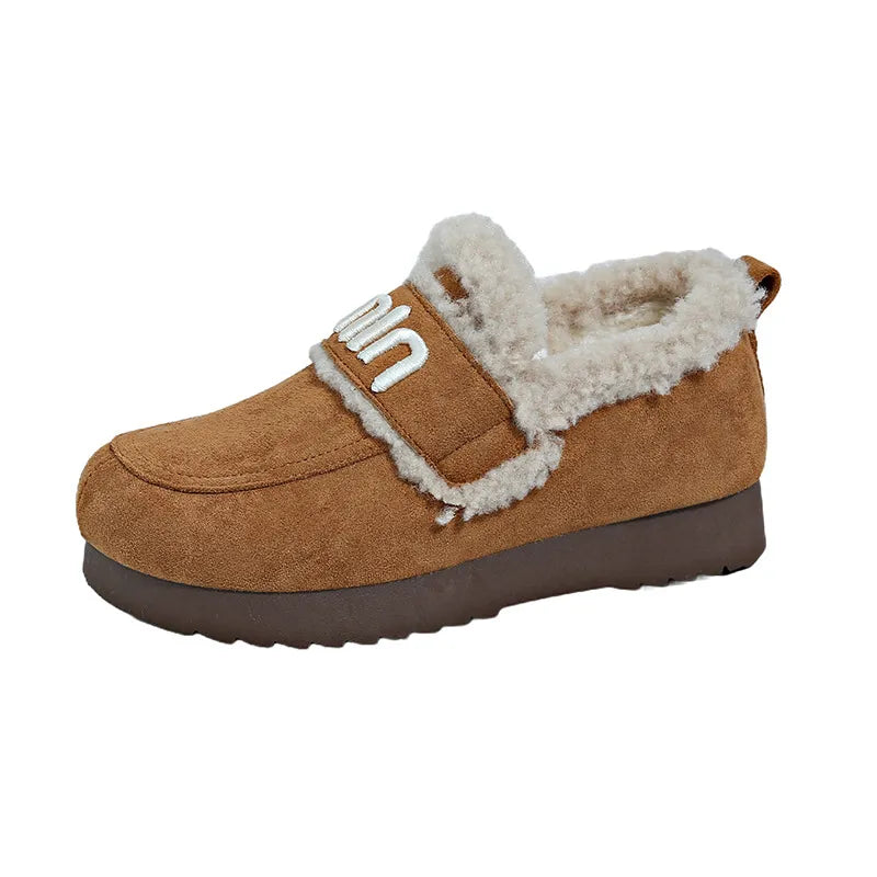 Faux fur suede slip-on shoes with round toe design, stylish footwear from Trendsi featuring cozy, plush material.
