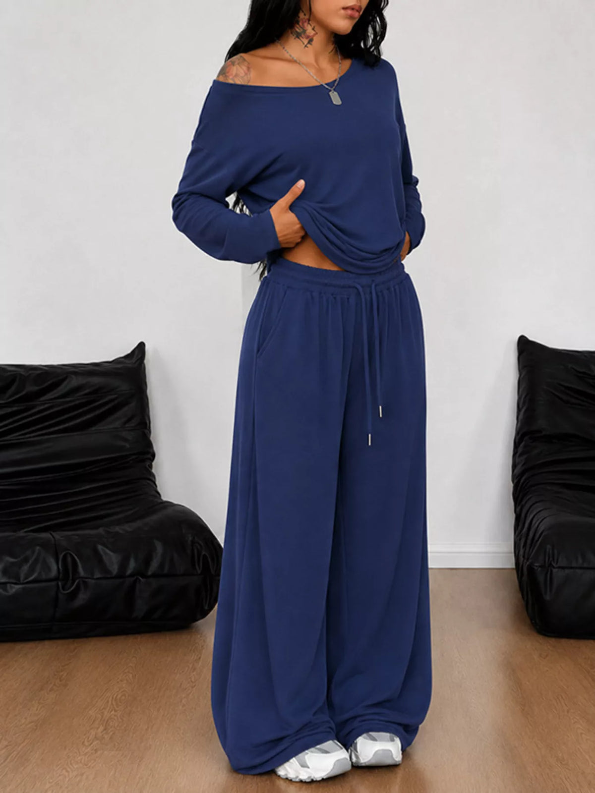 Plus size one-shoulder top and drawstring pants set by Trendsi, featuring a stylish matching set with a modern fit.