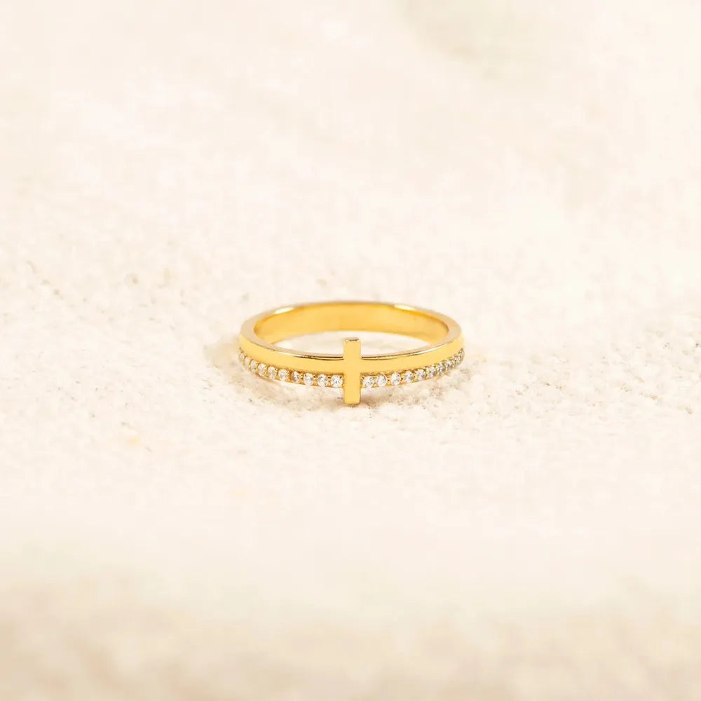 Sterling silver cross ring featuring a detailed design, crafted by Plush Fashion Hub, showcasing a sleek and elegant jewelry piece.