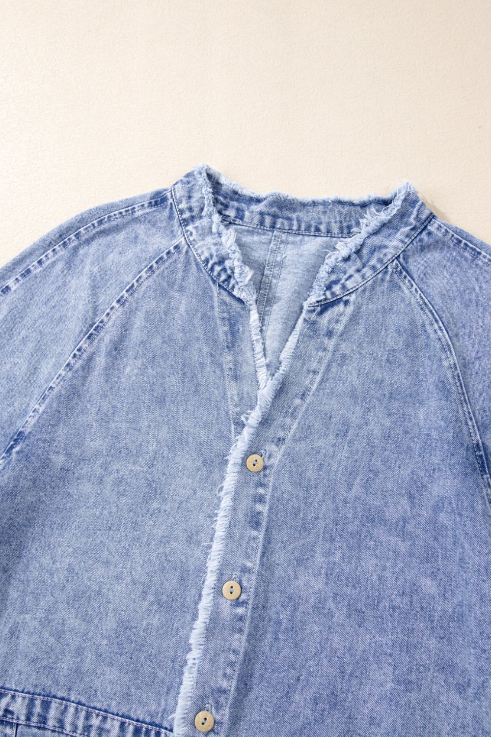 Raw hem button-down long sleeve denim dress by Plush Fashion Hub, featuring a casual fit with front buttons and a relaxed style.
