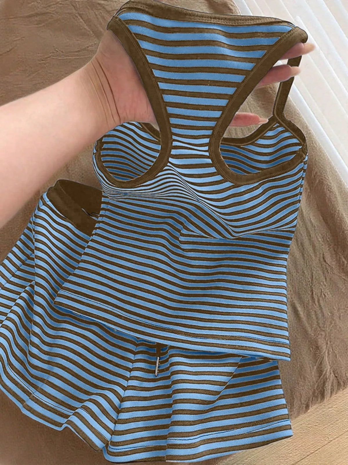Striped tank top and shorts set by Plush Fashion Hub, featuring a casual summer look with colorful stripes and lightweight fabric.