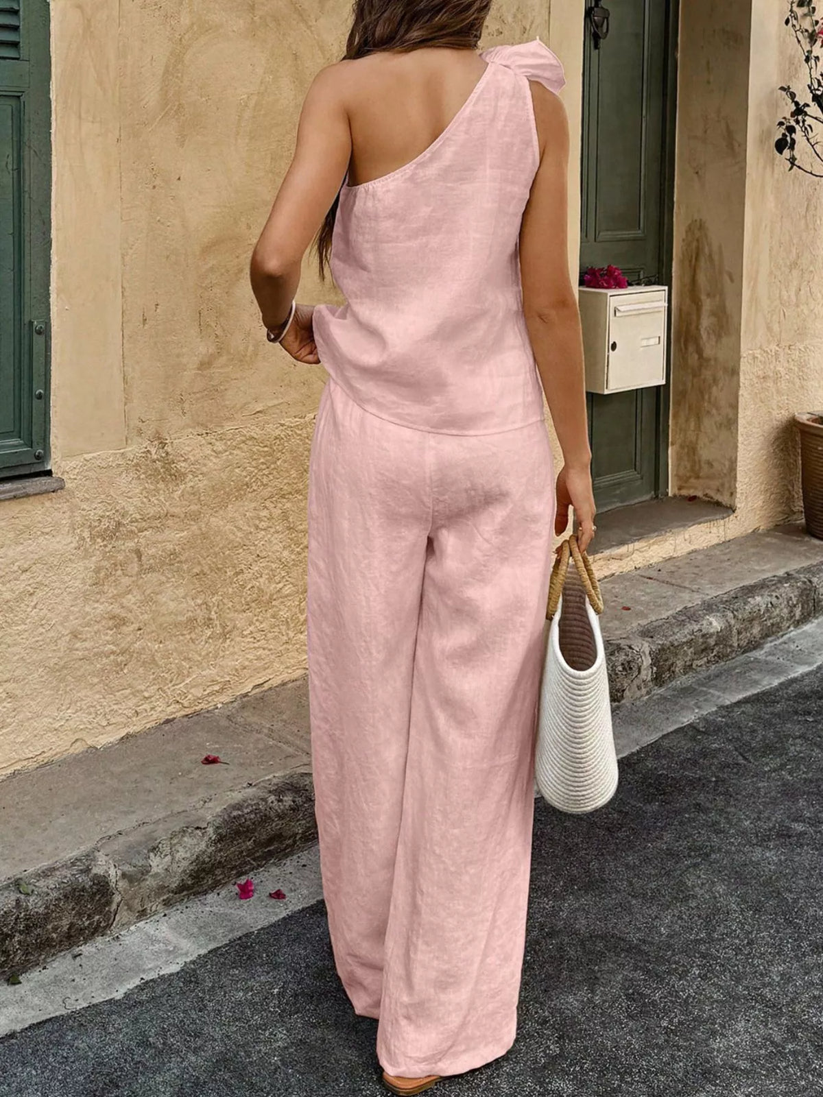 Plush Fashion Hub one-shoulder floral embellished top and matching pants set, stylish and vibrant for trendy summer wear.