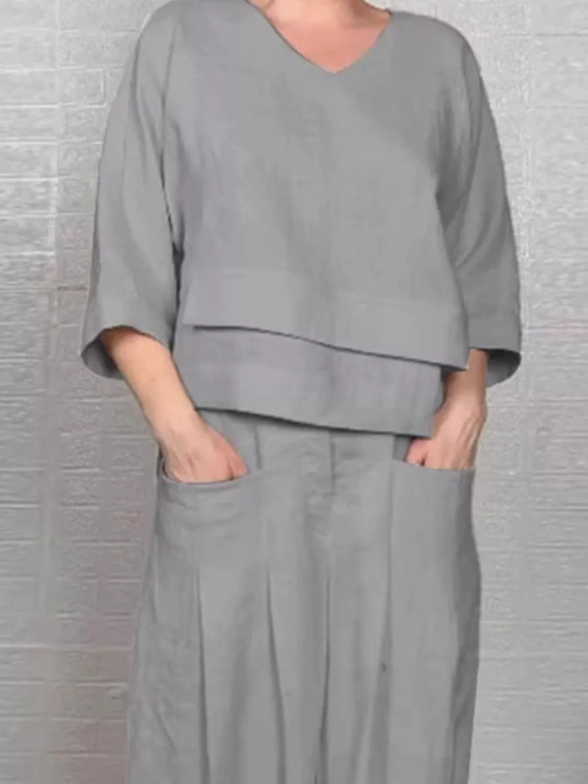 Plus size full V-neck long sleeve top and matching pants set by Trendsi, stylish and comfortable casual wear for women.