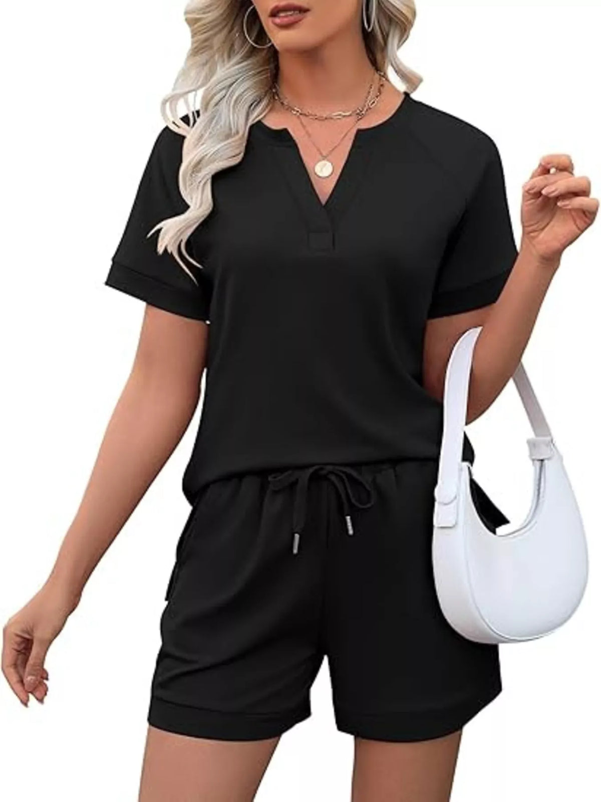 Solid color short sleeve top and matching shorts two-piece set from Plush Fashion Hub, casual summer apparel for women.