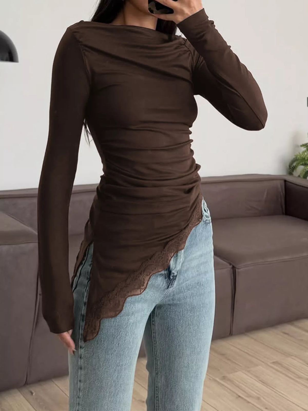 Asymmetrical one-shoulder ruched T-shirt with lace trim, stylish shirt by Trendsi, featuring a unique design and delicate lace accents.
