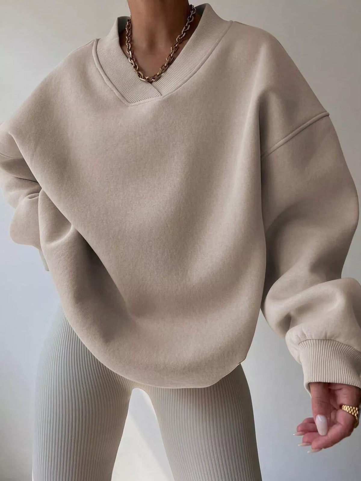Oversized dropped shoulder long sleeve sweatshirt in soft fabric, trendy and comfortable, by Trendsi.