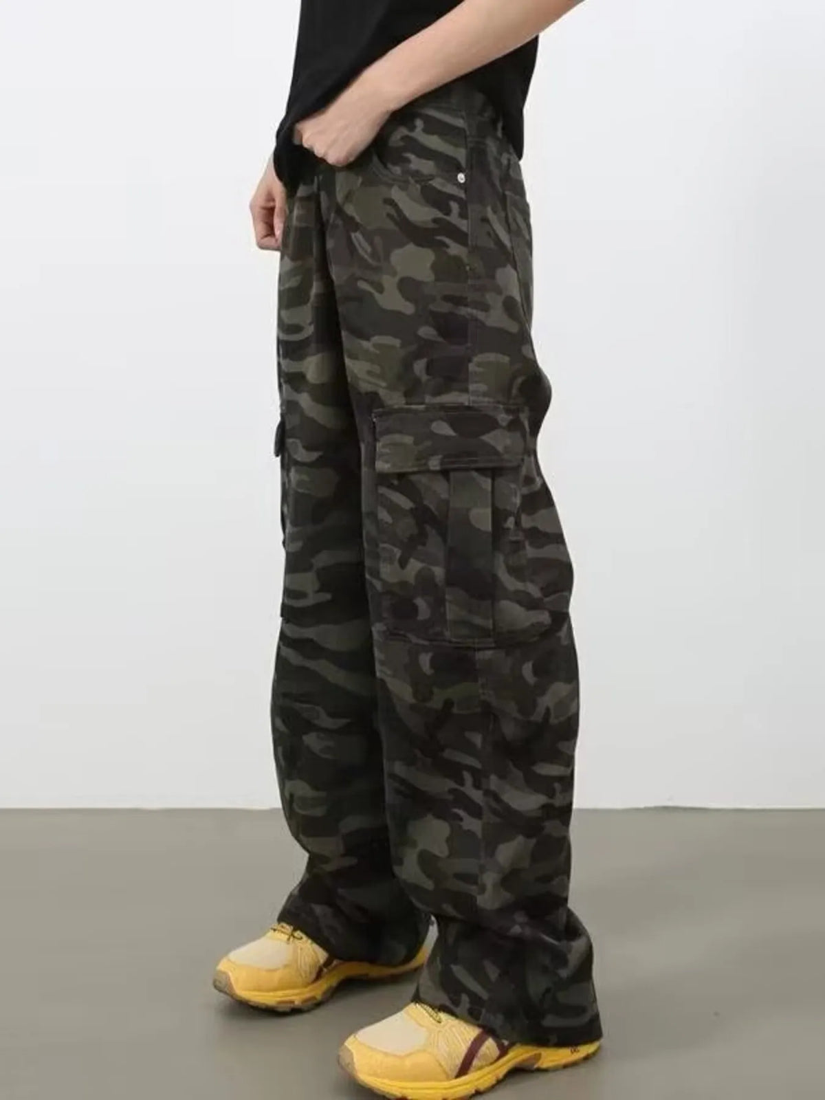 Men's full size camouflage print wide leg cargo jeans by Plush Fashion Hub, featuring a relaxed fit and multiple utility pockets.