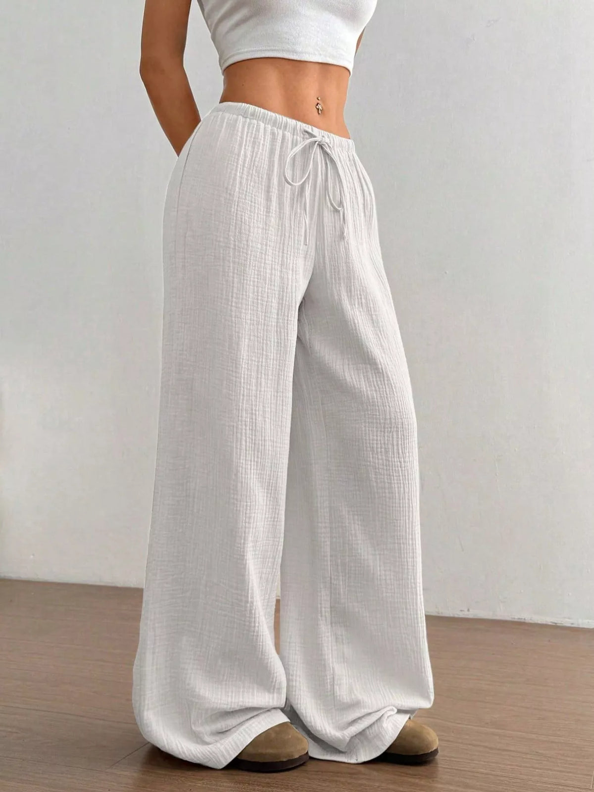 Plush Fashion Hub wide-leg drawstring pants in soft, cozy fabric, featuring a relaxed fit and casual style.