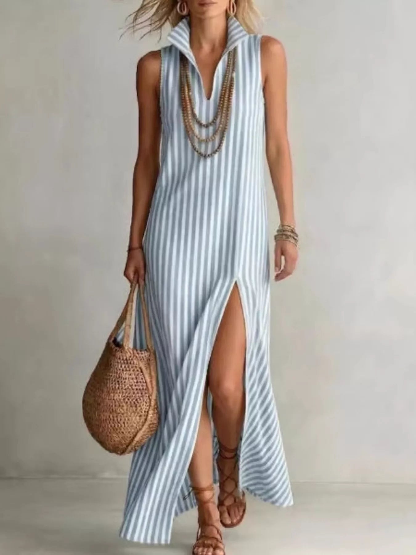 Plus size striped maxi dress with high slit from Trendsi, featuring a flowing design and bold vertical stripes.