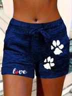 Women's printed elastic waist cropped shorts with pockets, casualwear by Plush Fashion Hub, featuring vibrant patterns and comfortable fit.