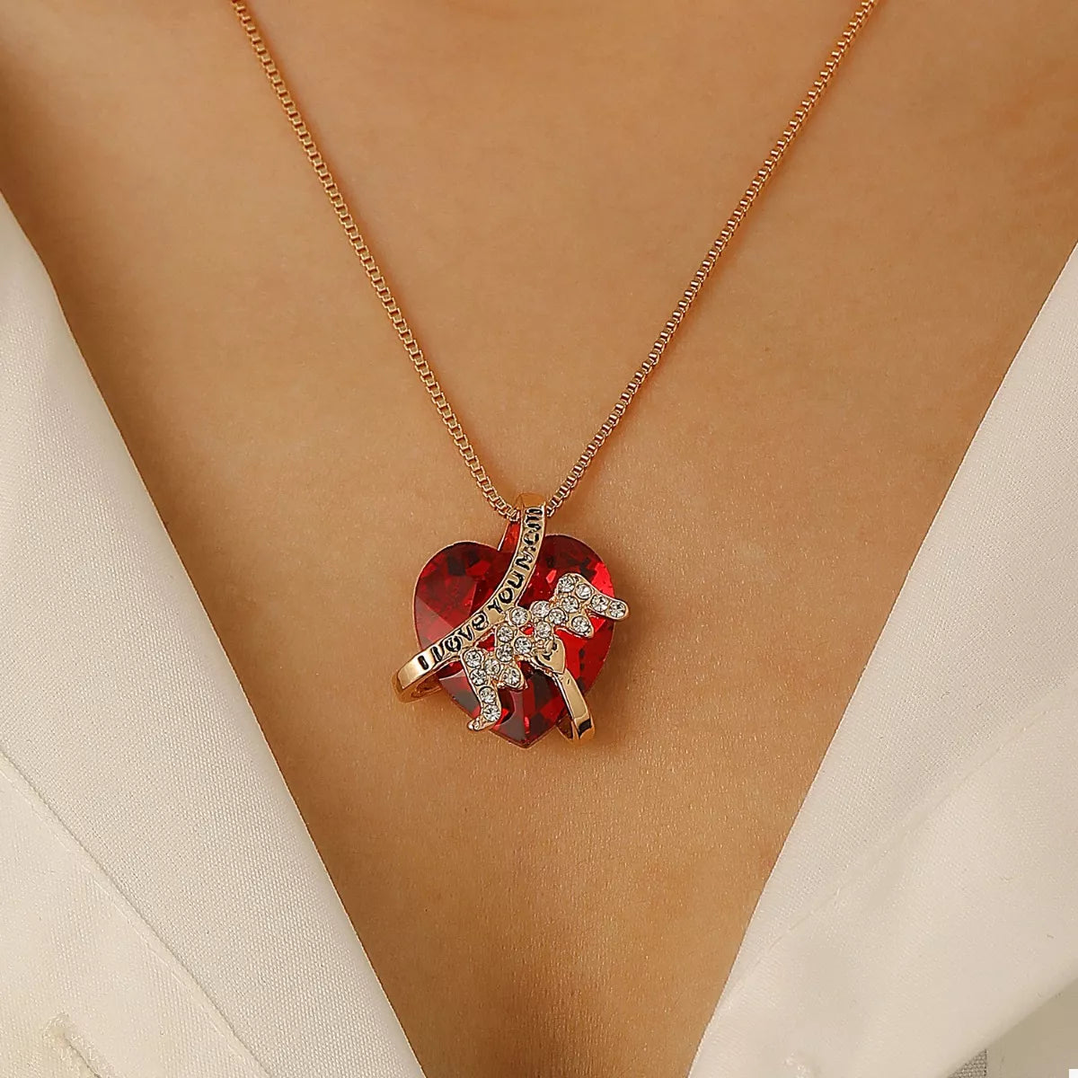 Heart-shaped MOM pendant necklace with a gold-tone chain, featuring a polished heart charm, by Plush Fashion Hub.