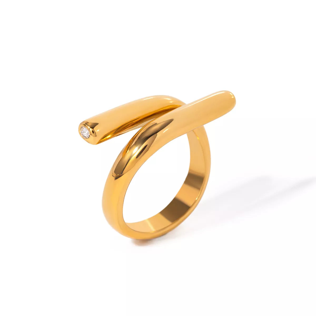 Stainless steel bypass ring from Plush Fashion Hub with sleek, modern design, showcasing smooth curves and polished finish.