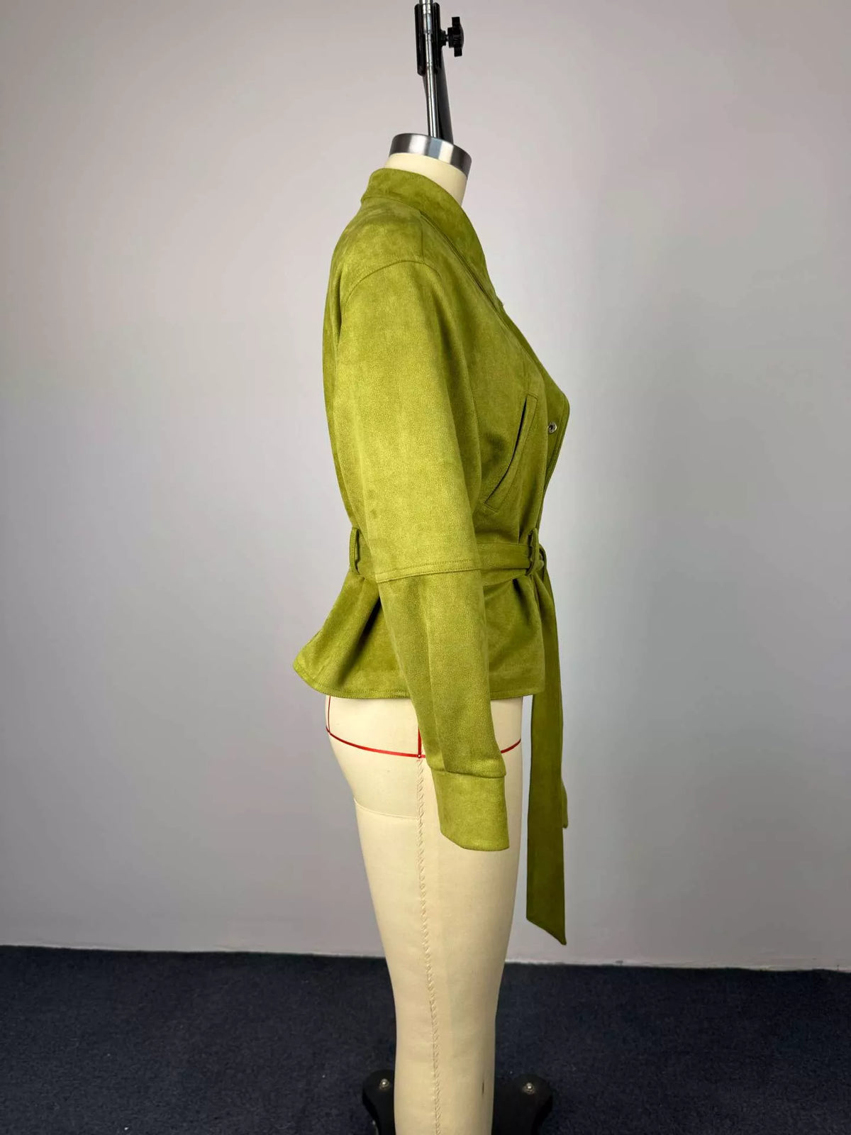 Women's tie waist long sleeve cropped jacket from Trendsi, featuring a stylish design with a fitted waist and long sleeves.