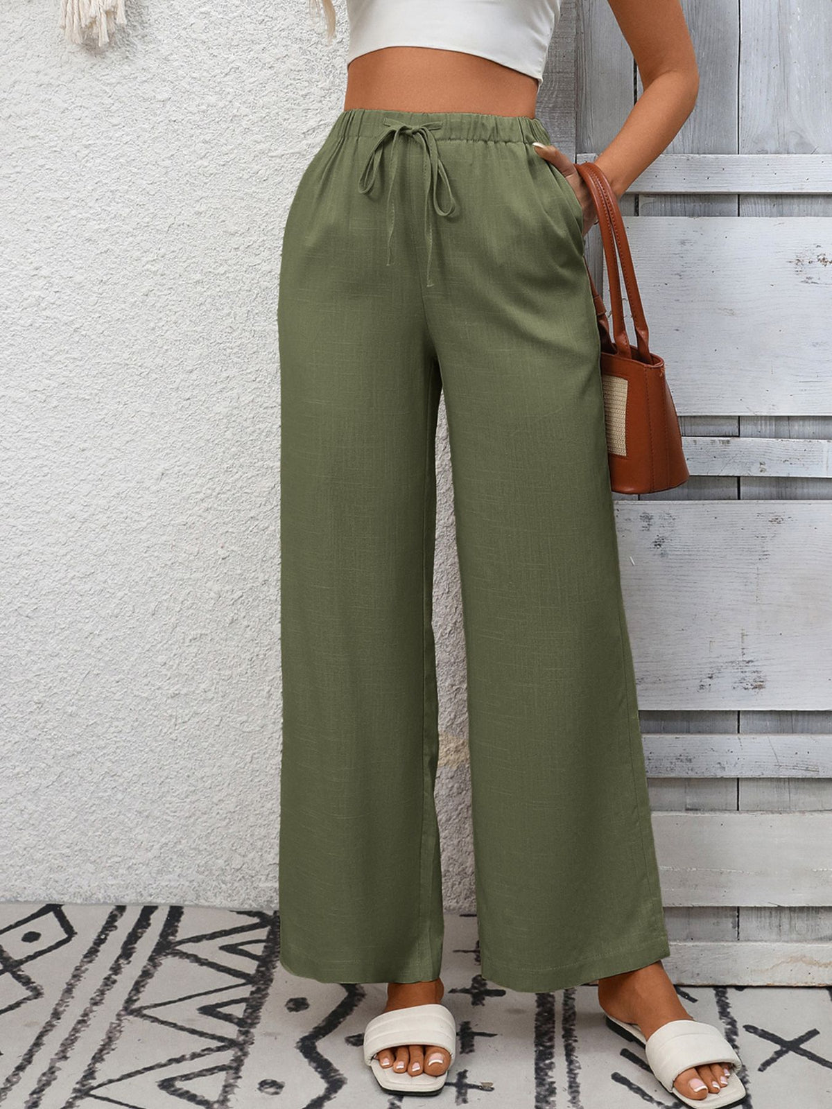 Women's high-waisted wide-leg drawstring pants in soft breathable viscose, featuring a relaxed fit and comfortable waistband.