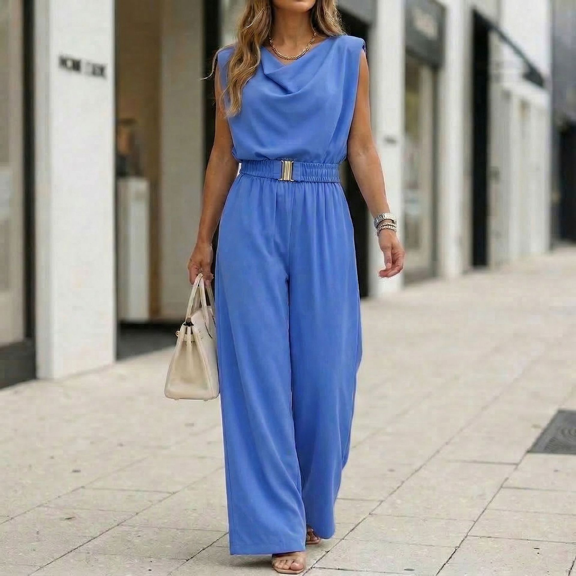 Women's off-shoulder sleeveless wide-leg jumpsuit with high waist and belt, casualwear by FitiqueFit, shown on a model.