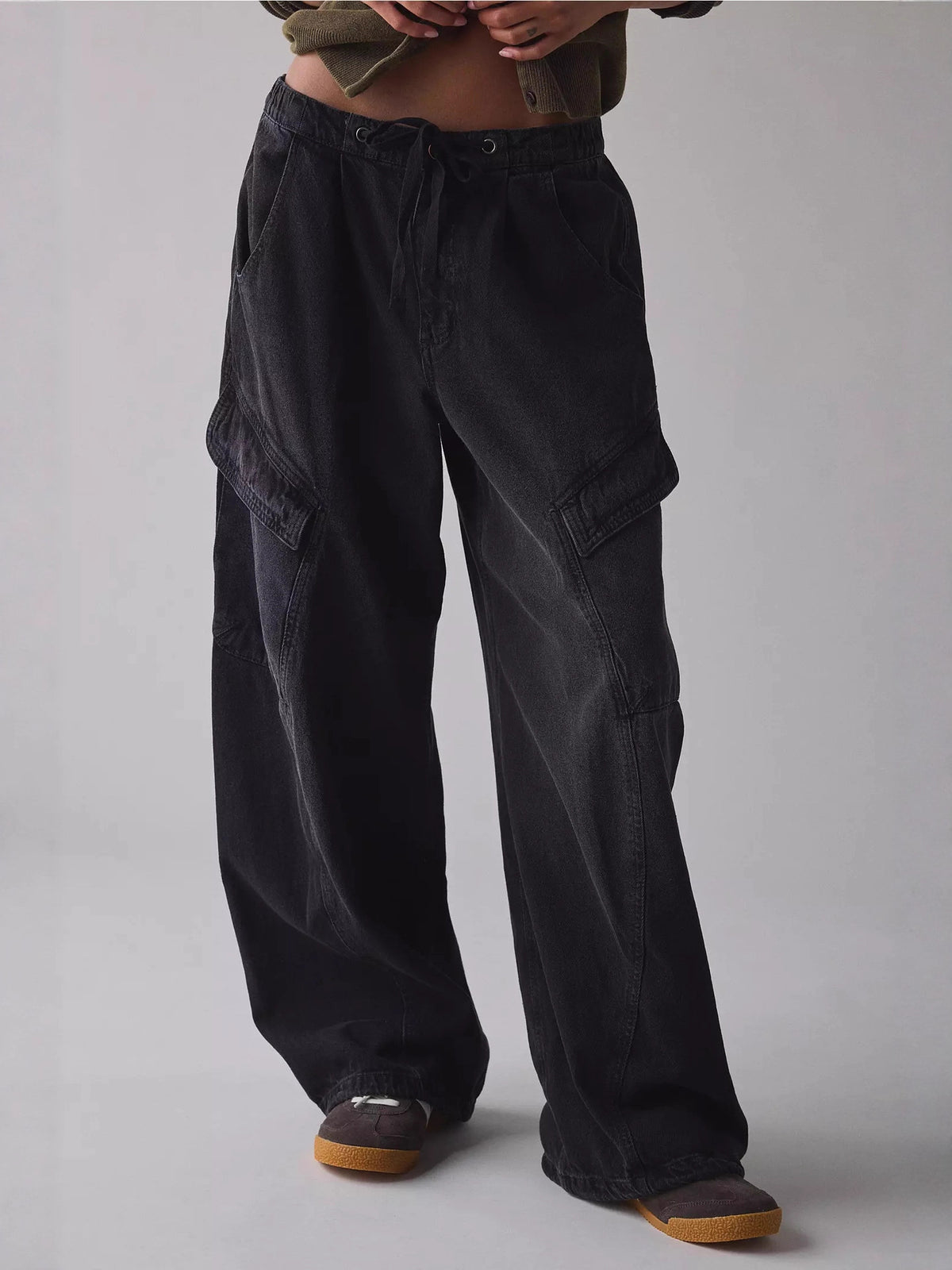 Women's relaxed fit utility denim cargo jeans with drawstring waist by Plush Fashion Hub, showing the style and pocket details.