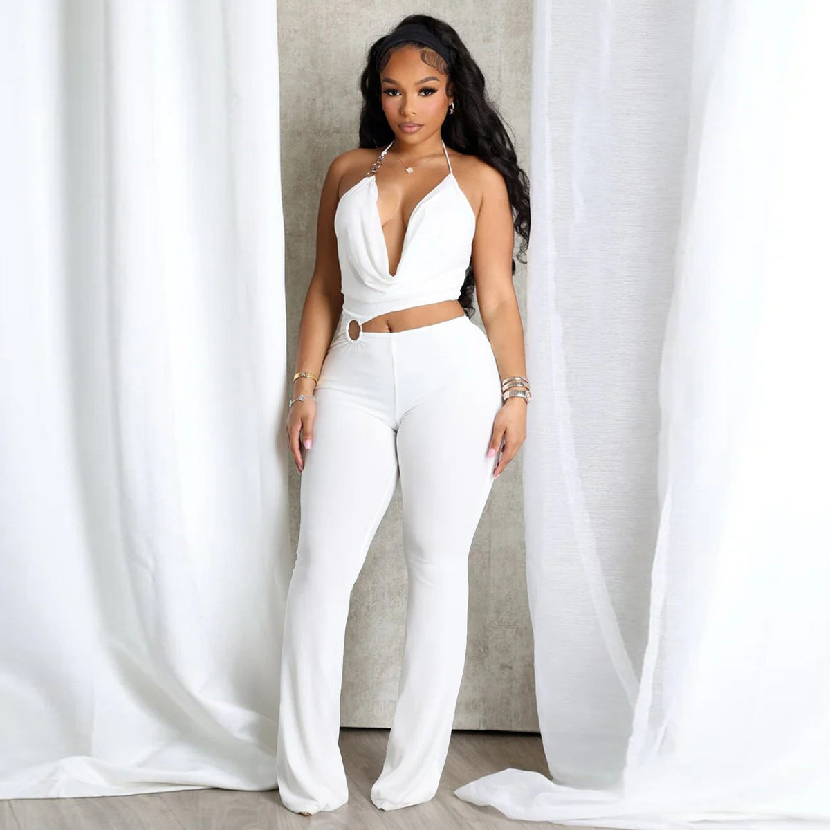 Plush Fashion Hub sleek halter neck cut-out waist jumpsuit with fitted silhouette, perfect for stylish modern wear.