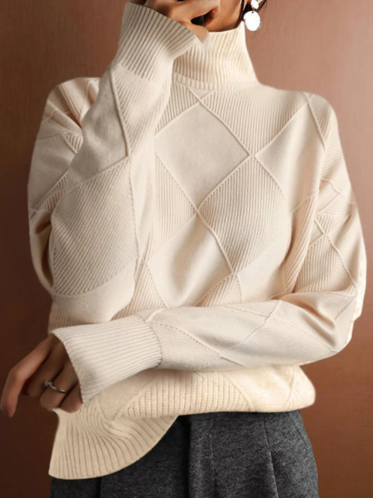 Argyle pattern turtleneck sweater from Trendsi, featuring a cozy knit design in classic colors, worn by a model.