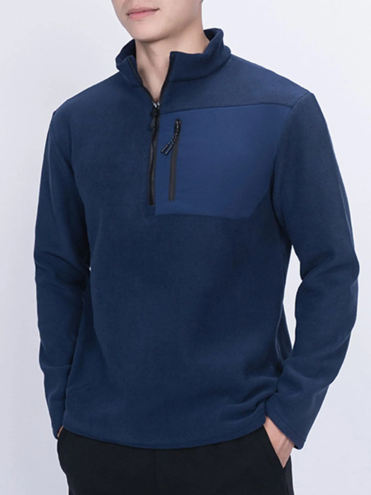 Men's plus size fleece sweatshirt with half-zip, chest pocket, in cozy fabric, by Trendsi, shown on a plain background.